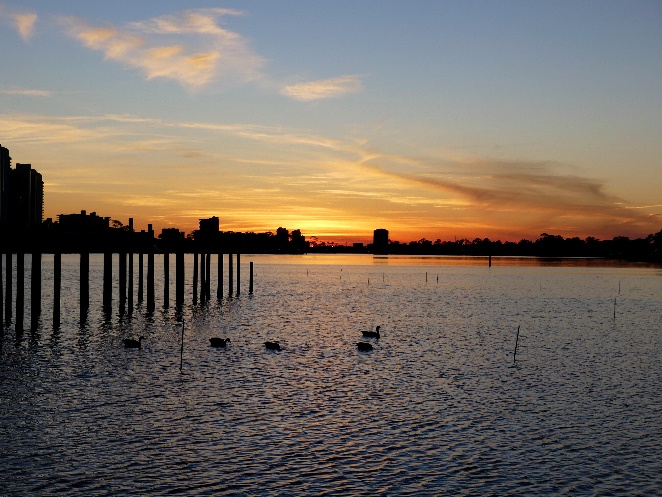 A picture containing water, sky, outdoor, sunset Description automatically generated