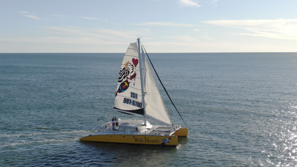 A sailboat in the water Description automatically generated